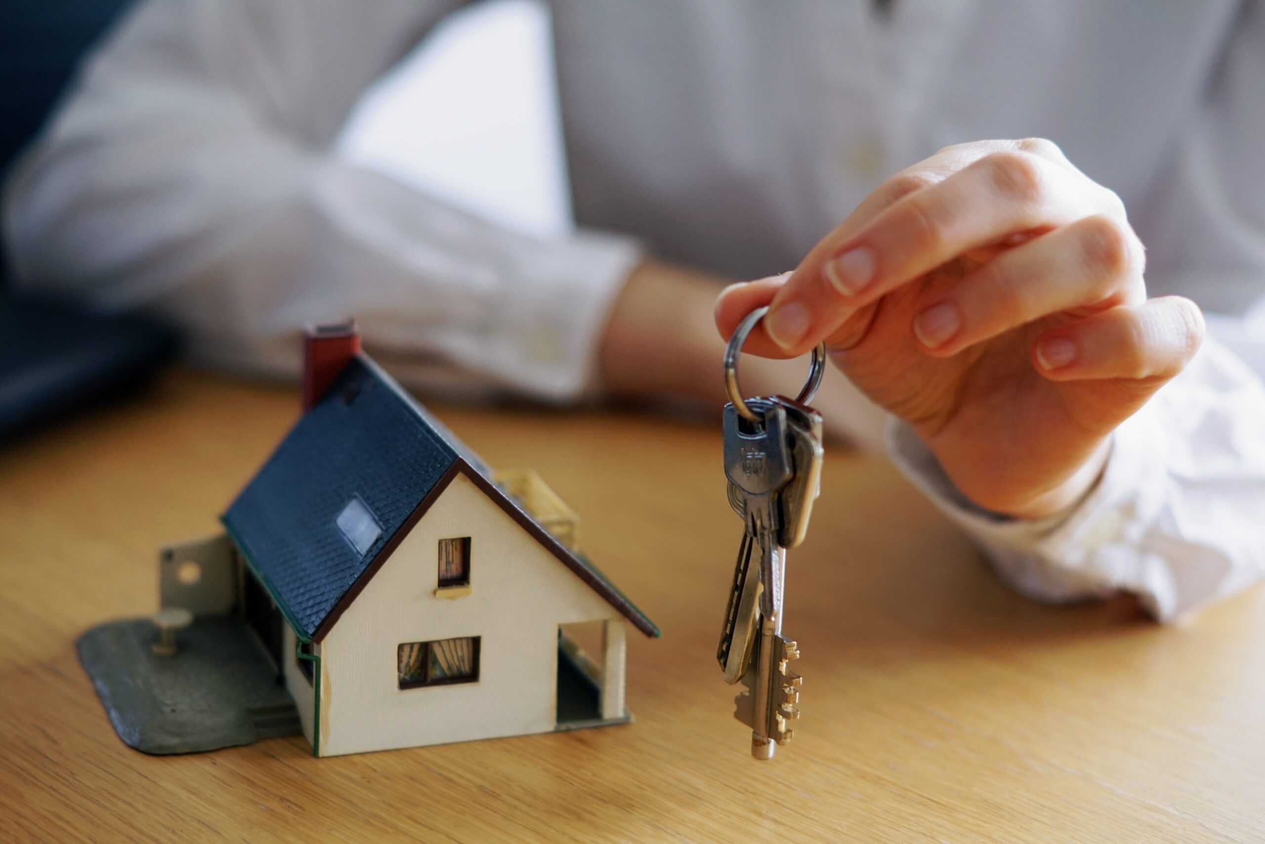closeup-shot-person-thinking-buying-selling-house-scaled.jpg