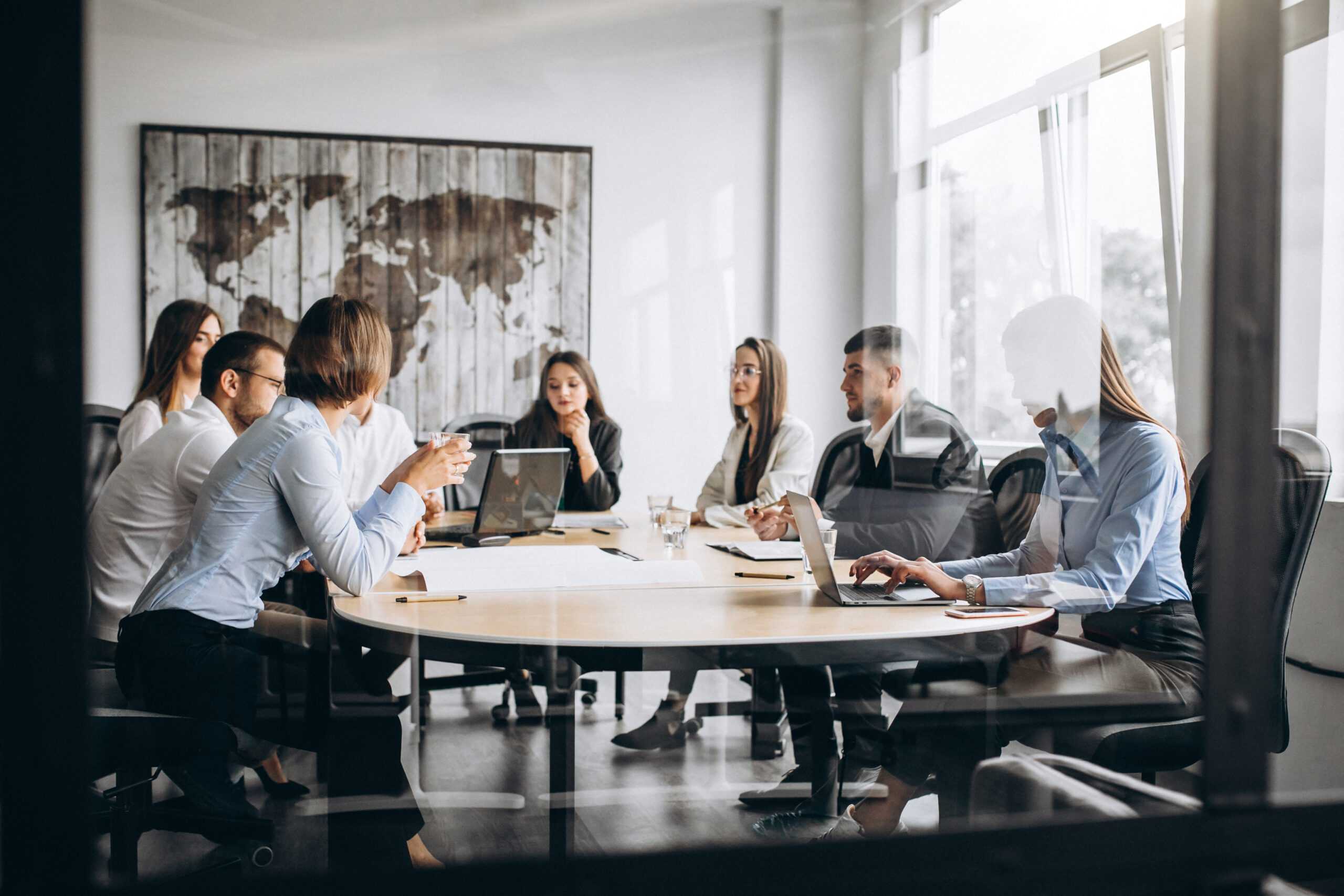 group-people-working-out-business-plan-office-scaled.jpg